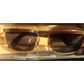 A COLLECTION OF POLICE VERSACE AND BVLGARI SPECTACLES SOLD AS IS