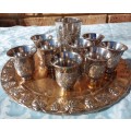 A VINTAGE KIDDUSH SET OF CUPS AND SERVING TRAY SOLD AS IS