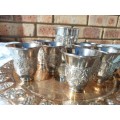 A VINTAGE KIDDUSH SET OF CUPS AND SERVING TRAY SOLD AS IS