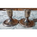 A SET STAINLESS STEEL CANDLE STANDS IN GOOD CONDITION SOLD AS IS