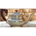 AN ANTIQUE EPNS SHEFFIELD TEAPOT WITH A TEAK HANDLE