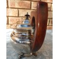 AN ANTIQUE EPNS SHEFFIELD TEAPOT WITH A TEAK HANDLE