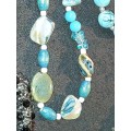 A COLLECTION OF VINTAGE TURQUOISE AND OTHER COSTUME NECKLACES SOLD AS IS