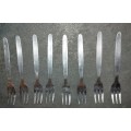 A SET OF 8 VINTAGE STAINLESS STEEL DESERT FORKS SOLD AS IS