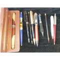 A COLLECTION OF BALL AND FOUNTAIN PENS AS WELL AS A LIVERPOOL PEN SOLD AS IS