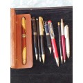 A COLLECTION OF BALL AND FOUNTAIN PENS AS WELL AS A LIVERPOOL PEN SOLD AS IS