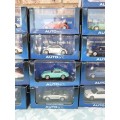 A COLLECTION OF 24 AUTO ART ADULT COLLECTORS EDITION DIECAST CARS IN MINT CONDITION SOLD AS IS