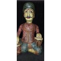 Indian Rajasthani folk art musician playing the tabla carved from wood and painted 18 inches in hei