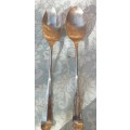 A CLASSIC DESIGNED PAIR OF SALAD TONGS SOLD AS IS