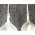 A  pair of stainless steel salad ladles sold as is