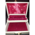 A VINTAGE JEWELRY BOX IN FAIR CONDITION NO KEYS SOLD AS IS