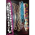 A COLLECTION OF SYNTHETIC BEAD COSTUME NECKLACES