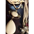 A BULK VINTAGE COLLECTION OF DESIGNER COSTUME NECKLACES SOLD AS IS