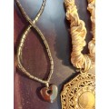 A BULK VINTAGE COLLECTION OF DESIGNER COSTUME NECKLACES SOLD AS IS