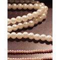 A BULK VINTAGE COLLECTION OF SYNTHETIC COSTUME PEARL BEAD NECKLACES