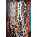 A BULK VINTAGE COLLECTION SYNTHETIC BEADED COSTUME NECKLACES
