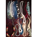 A BULK VINTAGE COLLECTION COSTUME NECKLACES SOLD AS IS