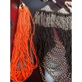 A COLLECTION OF VINTAGE MULTI-STRAND BEADED COSTUME NECKLACES SOLD AS IS