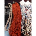 A COLLECTION OF VINTAGE MULTI-STRAND BEADED COSTUME NECKLACES SOLD AS IS