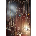 A BULK COLLECTION GOLD PLATED AND SILVER TONE PETIT COSTUME NECKLACES