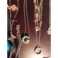 A BULK COLLECTION GOLD PLATED AND SILVER TONE PETIT COSTUME NECKLACES