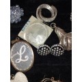 A FASHION DESIGNER COLLECTION EARRINGS, BROOCHES, AND PENDANTS SOLD AS IS