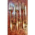 A SET OF SIX GOLDPLATED COCKTAIL FORKS MADE IN JAPAN SOLD AS IS
