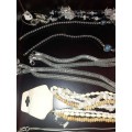 A VINTAGE COLLECTION OF COSTUME JEWELRY SOLD AS IS