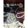 A VINTAGE COLLECTION OF COSTUME JEWELRY SOLD AS IS