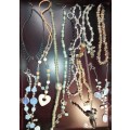 A COLLECTION OF VINTAGE COSTUME NECKLACES SOLD AS IS