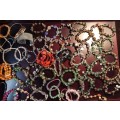 A JOB LOT COSTUME BRACELETS AND GOLD PLATED BANGLES SOLD AS IS