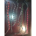 A COLLECTION OF MEGNATIC COSTUME NECKLACES SOLD AS IS