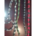 A COLLECTION OF MEGNATIC COSTUME NECKLACES SOLD AS IS