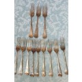 AN ANTIQUE SET OF TABLE FORKS SOLD AS IS