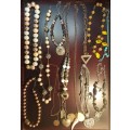 A VINTAGE COLLECTION OF COSTUME NECKLACES SOLD AS IS