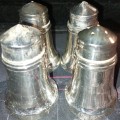 A SET OF 4 SALT AND PEPPER SHAKERS