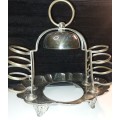 A VINTAGE BREAKFAST TOAST  SERVING STAND SILVER PLATED  SOLD AS IS