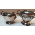 A VINTAGE COLLECTION SILVER PLATED SUGAR BOWLS AND MILK POTS SOLD AS IS