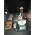 A COLLECTION OF FLASKS CIGARETTE LIGHTERS  POCKET KNIVES AND A LEATHER CIGARETTE HOLDER SOLD AS IS