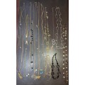 A  VINTAGE COLLECTION OF GOLD PLATED AND SILVER PLATED NECKLACES