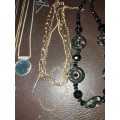 A  VINTAGE COLLECTION OF GOLD PLATED AND SILVER PLATED NECKLACES