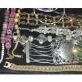 A BULK VINTAGE COLLECTION OF BRACELETS AND BANGLES SOLD AS IS