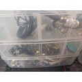 A BULK COLLECTION OF COSTUME JEWELRY AND THE PLASTIC CASES SOLD AS IS