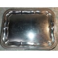 A VINTAGE SILVER PLATED RECTANGULAR SERVING TRAY SOLD AS IS