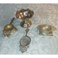 AN ANTIQUE COLLECTION OF VICTORIAN TEA STRAINERS SOLD AS IS