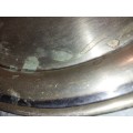 A ROUND CATERERS TRAY SILVER PLATED NEEDS TO BE POLISHED AND SOLD AS IS