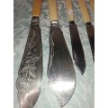 A COLLECTION OF BONE HANDLED CUTLERY SOLD AS IS