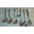 A COLLECTION OF VINTAGE SPOONS SOLD AS IS