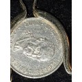 A VINTAGE FIVE CENT SOUTH AFRICAN COIN CIRCULATED IN A GOLD PLATED HOLDER AND CHAIN