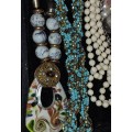 A COLLECTION OF COSTUME NECKLACES SOLD AS IS